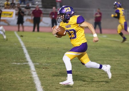 Tiger offense stymied Friday night as powerful Clovis West football team finds Tiger Stadium appealing in 40-14 win. On a bad snap, Lemoore kicker Jayden Evangelo took a bad snap and ran for a first down against Clovis West.